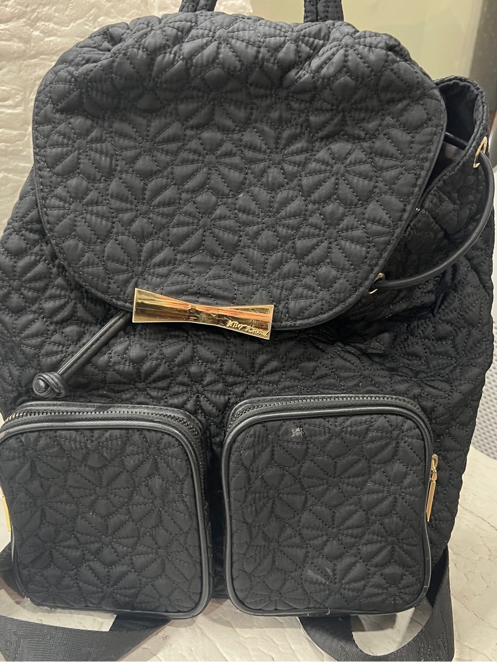 Betsey Johnson Black Quilted Flower Backpack with Gold Bow Accent
